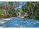 Charming backyard shed with surrounding landscaping and a quaint stone pathway at 508 N Mayo St, Crystal Beach, FL 34681