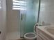 Updated bathroom with glass shower and modern fixtures at 5151 Janice Ln, Holiday, FL 34690