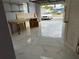 Tiled garage with storage shelves at 5151 Janice Ln, Holiday, FL 34690