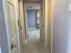 Hallway featuring tile floors connecting to rooms at 5151 Janice Ln, Holiday, FL 34690