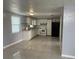 Bright kitchen with white cabinets, tile flooring, and modern appliances at 5151 Janice Ln, Holiday, FL 34690