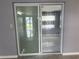 Sliding glass door leading to the outside, providing natural light at 5151 Janice Ln, Holiday, FL 34690