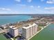 Aerial view of waterfront condos, coastline, and cityscape in the distance at 5200 Brittany S Dr # 1502, St Petersburg, FL 33715