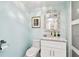 Bathroom including a toilet, vanity with granite counter and ornamental mirror, and a sliding glass door shower at 5200 Brittany S Dr # 1502, St Petersburg, FL 33715