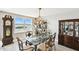 Elegant dining room featuring unique light fixtures, antique decor, and stunning water view at 5200 Brittany S Dr # 1502, St Petersburg, FL 33715