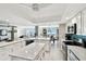 Bright kitchen with white cabinetry, modern appliances, and an open layout perfect for entertaining at 5200 Brittany S Dr # 1502, St Petersburg, FL 33715
