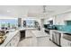 Spacious kitchen with granite countertops, stainless steel appliances, and functional kitchen island at 5200 Brittany S Dr # 1502, St Petersburg, FL 33715