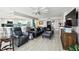 Open-concept living room with modern decor, stylish furniture, and seamless flow into the kitchen at 5200 Brittany S Dr # 1502, St Petersburg, FL 33715