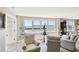 Bright and airy living room with large windows offers stunning views of the bay at 5200 Brittany S Dr # 1502, St Petersburg, FL 33715