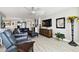 Comfortable living room featuring elegant furnishings, ambient lighting, and a chic entertainment center at 5200 Brittany S Dr # 1502, St Petersburg, FL 33715