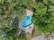 Aerial view of the property showcasing the pool area and lush landscaping at 5503 67Th N Ave # 18, Pinellas Park, FL 33781