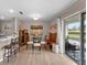 Bright dining area adjacent to kitchen features an outdoor view through sliding glass doors at 5503 67Th N Ave # 18, Pinellas Park, FL 33781