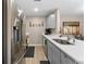 Kitchen boasts stainless steel appliances, light grey cabinets, and ample counter space at 5503 67Th N Ave # 18, Pinellas Park, FL 33781