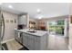 Bright kitchen features gray cabinets, stainless steel appliances, and quartz countertops at 5503 67Th N Ave # 18, Pinellas Park, FL 33781