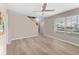 Empty living room with wood-look flooring and a ceiling fan at 5503 67Th N Ave # 18, Pinellas Park, FL 33781
