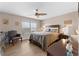 Comfortable main bedroom with natural light, ceiling fan, and coordinating decor at 5503 67Th N Ave # 18, Pinellas Park, FL 33781