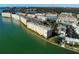 Panoramic aerial view of waterfront condos with boat docks and stunning views of the tranquil water and community at 5935 30Th S Ave # 308, Gulfport, FL 33707