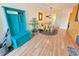 Bright dining area features a stylish table, a unique entry bench, and is adjacent to the kitchen at 5935 30Th S Ave # 308, Gulfport, FL 33707