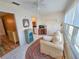 Sunroom with water views, cozy seating, and stylish decor, perfect for relaxing and enjoying the peaceful surroundings at 5935 30Th S Ave # 308, Gulfport, FL 33707