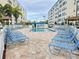 Community pool area with lounge chairs offering a relaxing outdoor space at 5935 30Th S Ave # 308, Gulfport, FL 33707