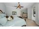 Comfortable bedroom featuring a ceiling fan and neutral tones at 597 Bay St, Palm Harbor, FL 34683
