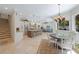 Bright open-concept dining room next to a modern kitchen at 597 Bay St, Palm Harbor, FL 34683