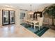 Bright dining room featuring a large dining table, stylish lighting, and elegant decor at 597 Bay St, Palm Harbor, FL 34683