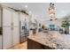 Open kitchen featuring granite countertops and stainless steel appliances at 597 Bay St, Palm Harbor, FL 34683