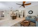 Open-concept kitchen with island seating, stainless appliances, and a tile backsplash at 597 Bay St, Palm Harbor, FL 34683