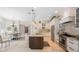 Well-equipped kitchen features an island, stainless steel appliances, and modern lighting at 597 Bay St, Palm Harbor, FL 34683