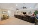 Spacious living room with ceiling fans and carpet flooring at 597 Bay St, Palm Harbor, FL 34683