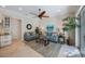 Inviting living room features a ceiling fan, wall art, and a neutral color palette at 597 Bay St, Palm Harbor, FL 34683