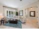Bright living room with stylish furniture, area rug, and tiled floor at 597 Bay St, Palm Harbor, FL 34683