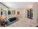 Bright living room with stylish furniture, area rug, and tiled floor at 597 Bay St, Palm Harbor, FL 34683