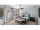 Serene main bedroom with a ceiling fan, private access to the outside, and bright, natural light at 597 Bay St, Palm Harbor, FL 34683