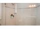 Close-up of a shower with glass door and tile surround at 597 Bay St, Palm Harbor, FL 34683