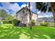 Lush backyard features mature landscaping and screened-in lanai at 6112 Ibispark Dr, Lithia, FL 33547