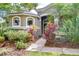 Inviting front entrance with colorful landscaping and stone accents at 6112 Ibispark Dr, Lithia, FL 33547