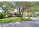 Beautiful home exterior with mature trees and landscaping at 6112 Ibispark Dr, Lithia, FL 33547