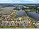 Beautiful aerial view of homes surrounding a large lake in this community at 626 15Th Nw Ave, Ruskin, FL 33570