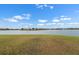 Expansive backyard overlooking the lake at 626 15Th Nw Ave, Ruskin, FL 33570