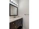 Modern bathroom featuring vanity, dark wood cabinets, drawers and light fixtures at 626 15Th Nw Ave, Ruskin, FL 33570
