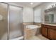 Bathroom with a soaking tub and glass enclosed shower at 626 15Th Nw Ave, Ruskin, FL 33570