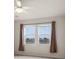 Bedroom featuring neutral colors and two windows with curtains at 626 15Th Nw Ave, Ruskin, FL 33570