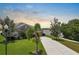 Charming home featuring lush landscaping and serene water views at 626 15Th Nw Ave, Ruskin, FL 33570