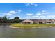 Exterior view showing the back of several homes near the water at 626 15Th Nw Ave, Ruskin, FL 33570