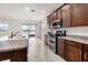 Kitchen with stainless steel appliances, granite countertops, and large island, with water views at 626 15Th Nw Ave, Ruskin, FL 33570