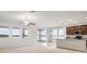 Bright kitchen with an island and stainless steel appliances and water views from the living area at 626 15Th Nw Ave, Ruskin, FL 33570