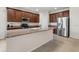 Kitchen boasts stainless steel appliances, granite countertops and a central island perfect for entertaining at 626 15Th Nw Ave, Ruskin, FL 33570