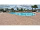 Large community swimming pool with ample lounge seating, perfect for relaxing and enjoying the sunny outdoors at 626 15Th Nw Ave, Ruskin, FL 33570